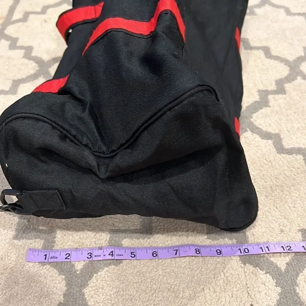 True Religion Black and Red Strap Duffel Bag